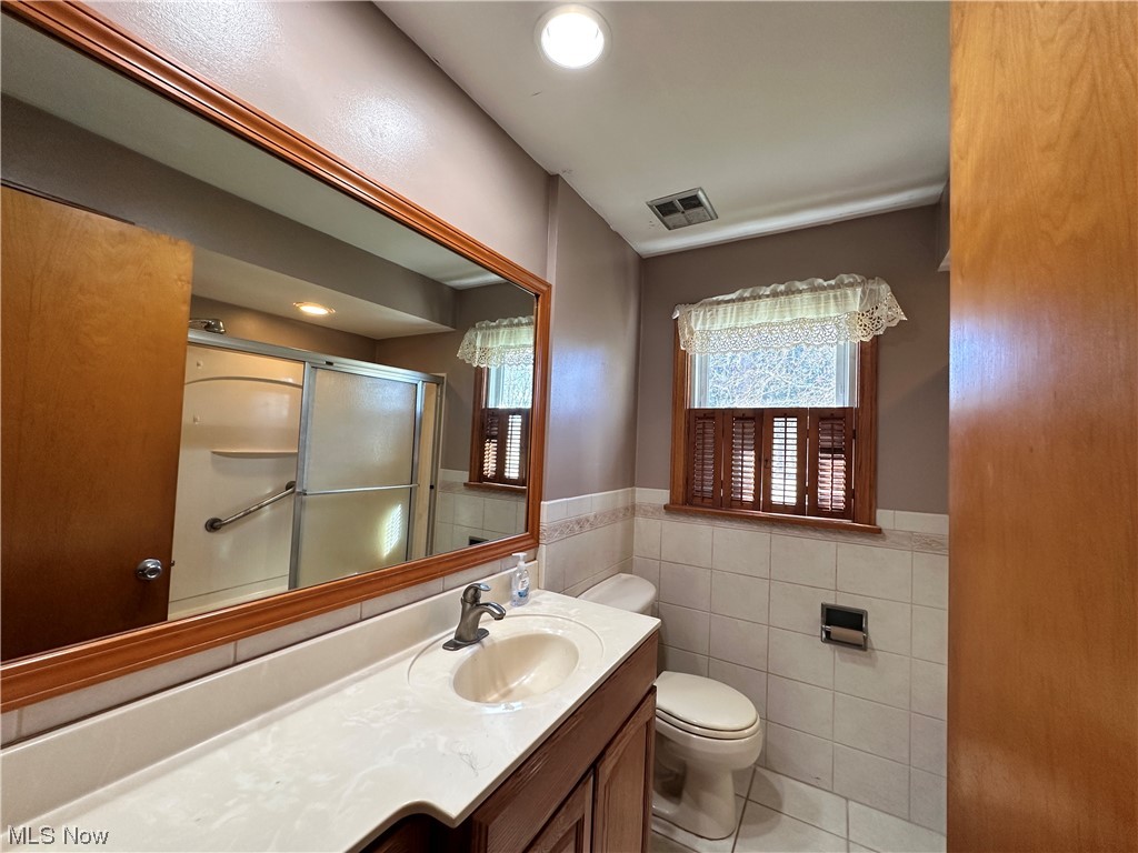 11617 Springfield Road North Lima, OH 44452 - Photo 18 of 28 Bathroom with tile flooring, oversized vanity, tile walls
