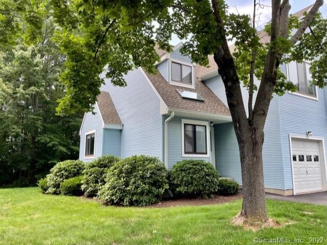 21 Field Rock Road, Unit 21 Farmington, CT 06032 - Photo 1 of 1 a front view of a house with a yard