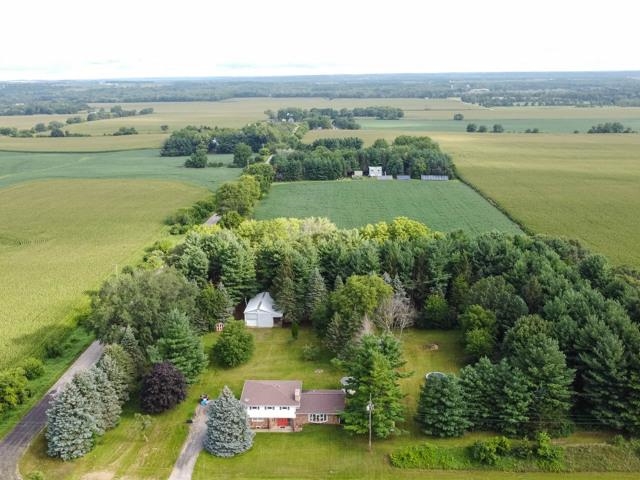 9473 Cemetery Road Winnebago, IL 61088 - Photo 1 of 24 an aerial view of ocean with residential house with outdoor space and trees