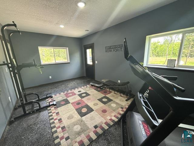 3454 Anderson Road Hibbing, MN 55746 - Photo 19 of 31 Spacious room with dark gray walls and recessed lighting