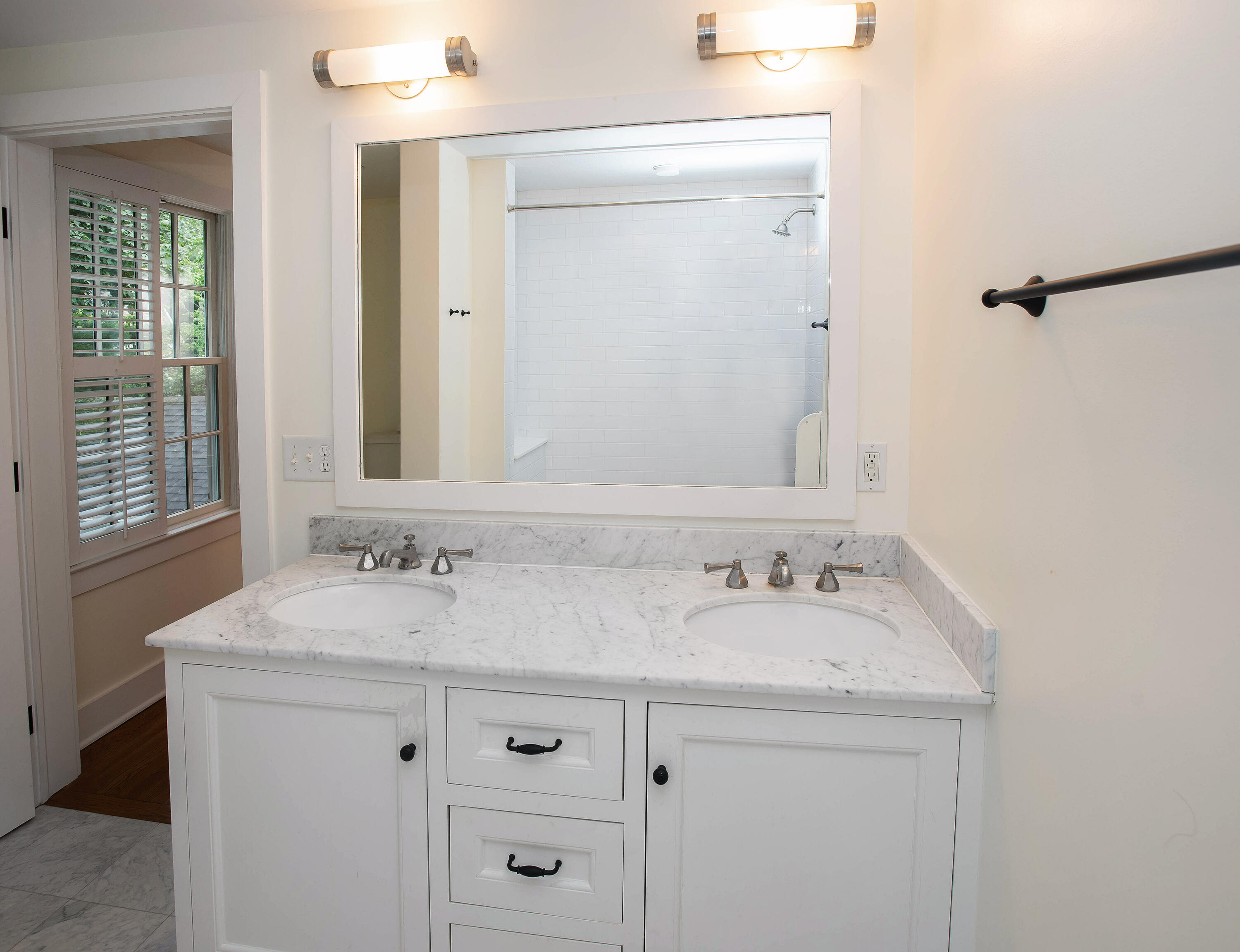 64 Sunrise Avenue New Canaan, CT 06840 - Photo 12 of 22 a bathroom with a sink and a mirror
