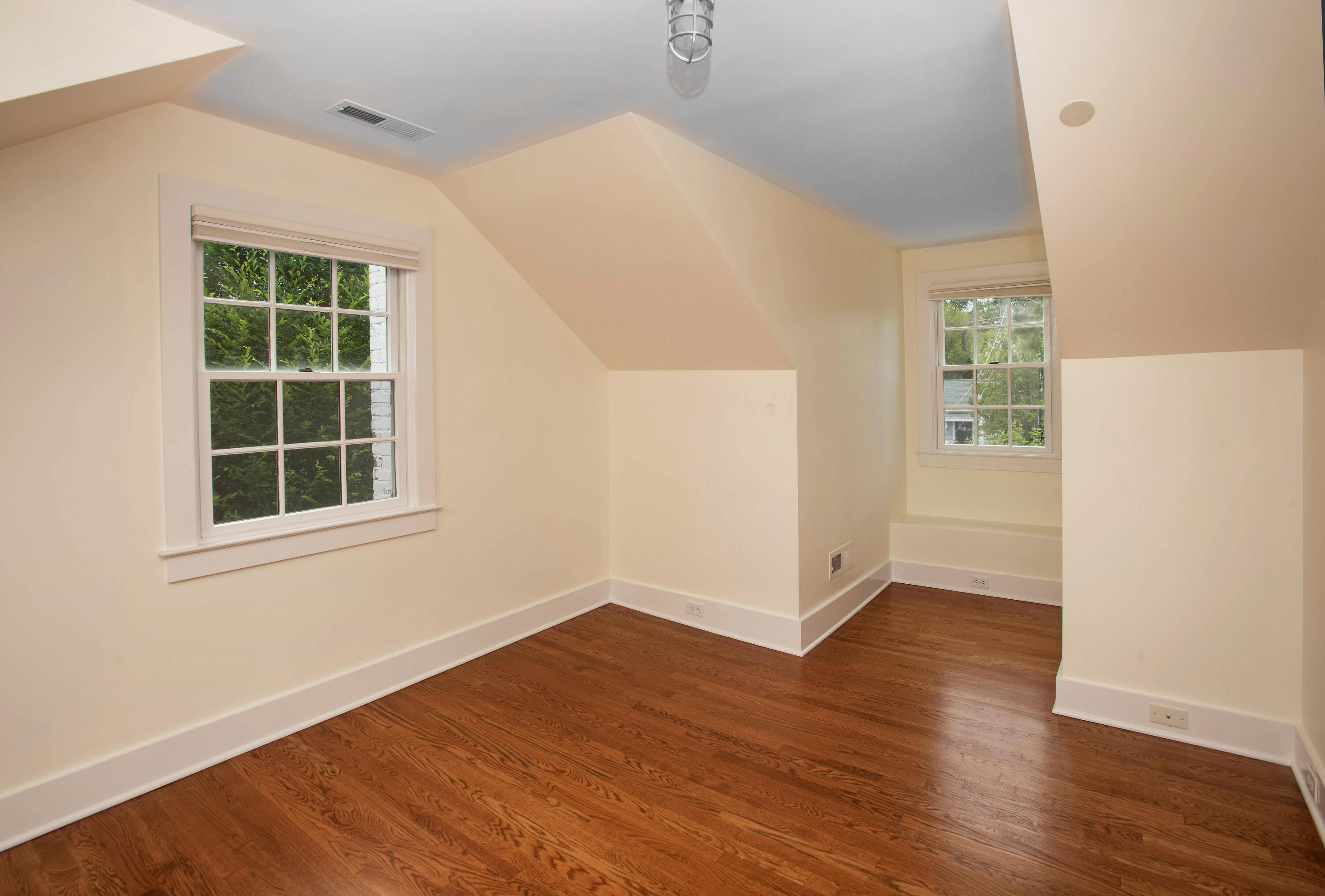 64 Sunrise Avenue New Canaan, CT 06840 - Photo 14 of 22 an empty room with wooden floor and windows