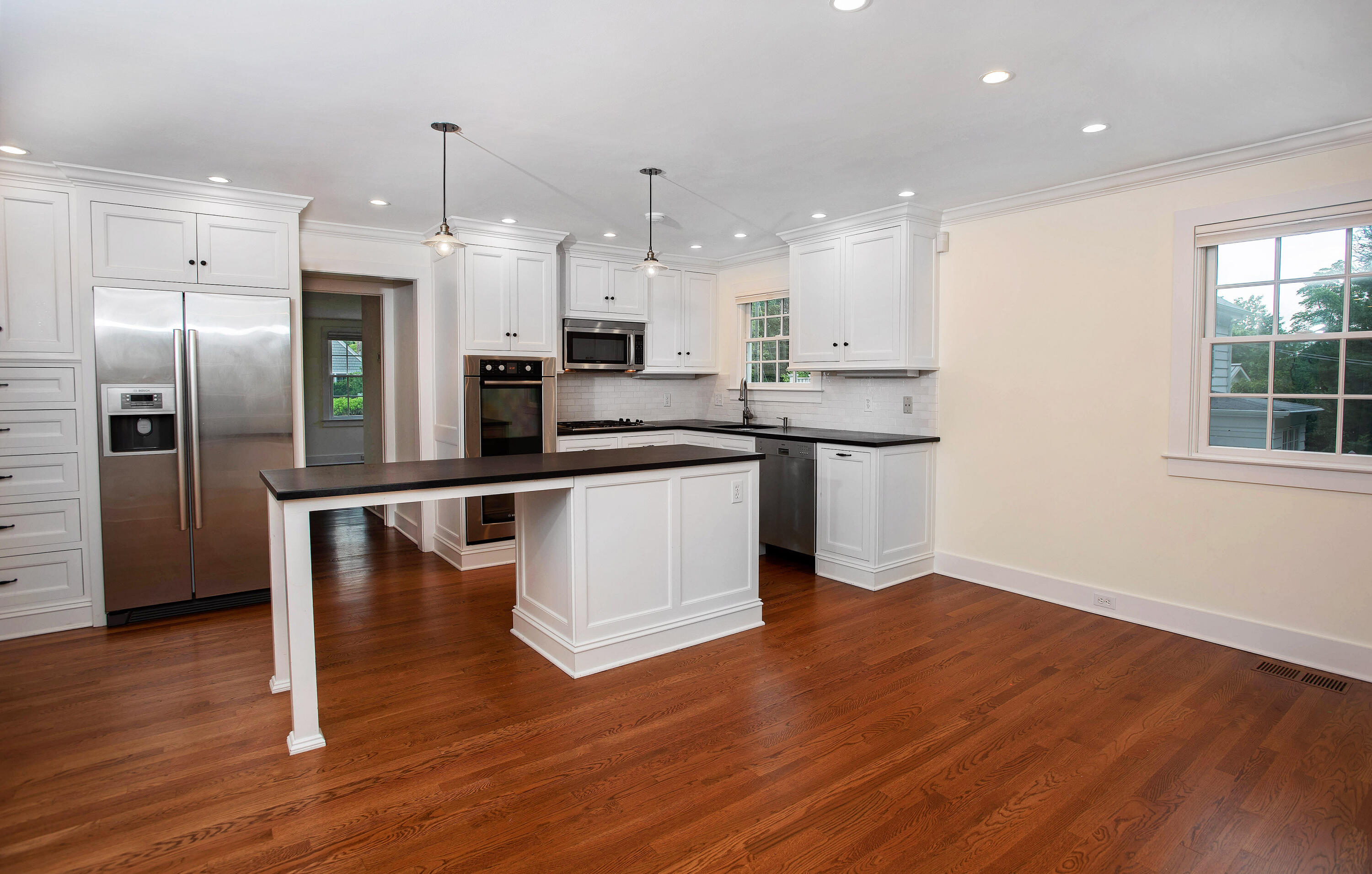 64 Sunrise Avenue New Canaan, CT 06840 - Photo 5 of 22 a kitchen with stainless steel appliances a refrigerator and a microwave