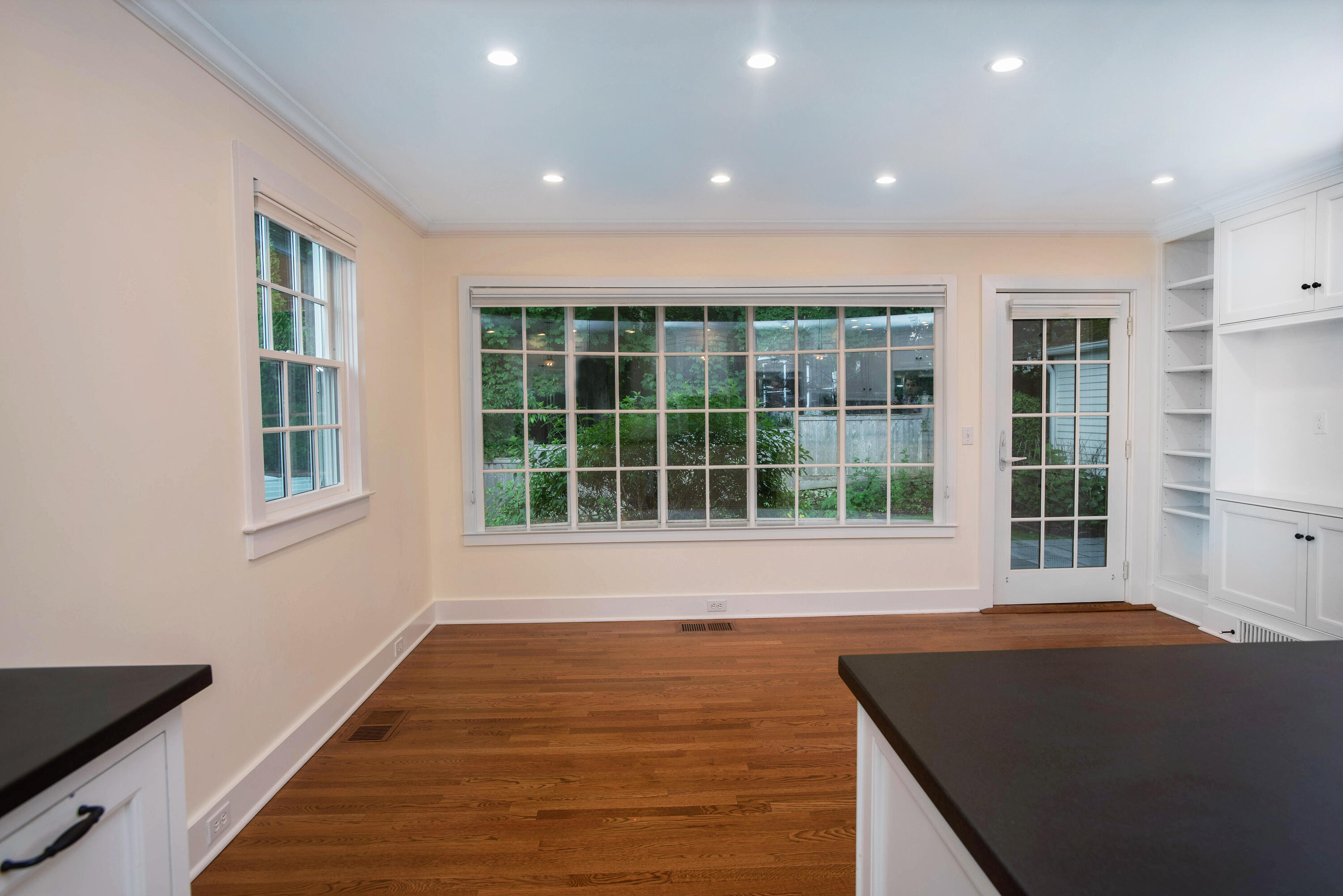 64 Sunrise Avenue New Canaan, CT 06840 - Photo 7 of 22 a view of an empty room with wooden floor and a window