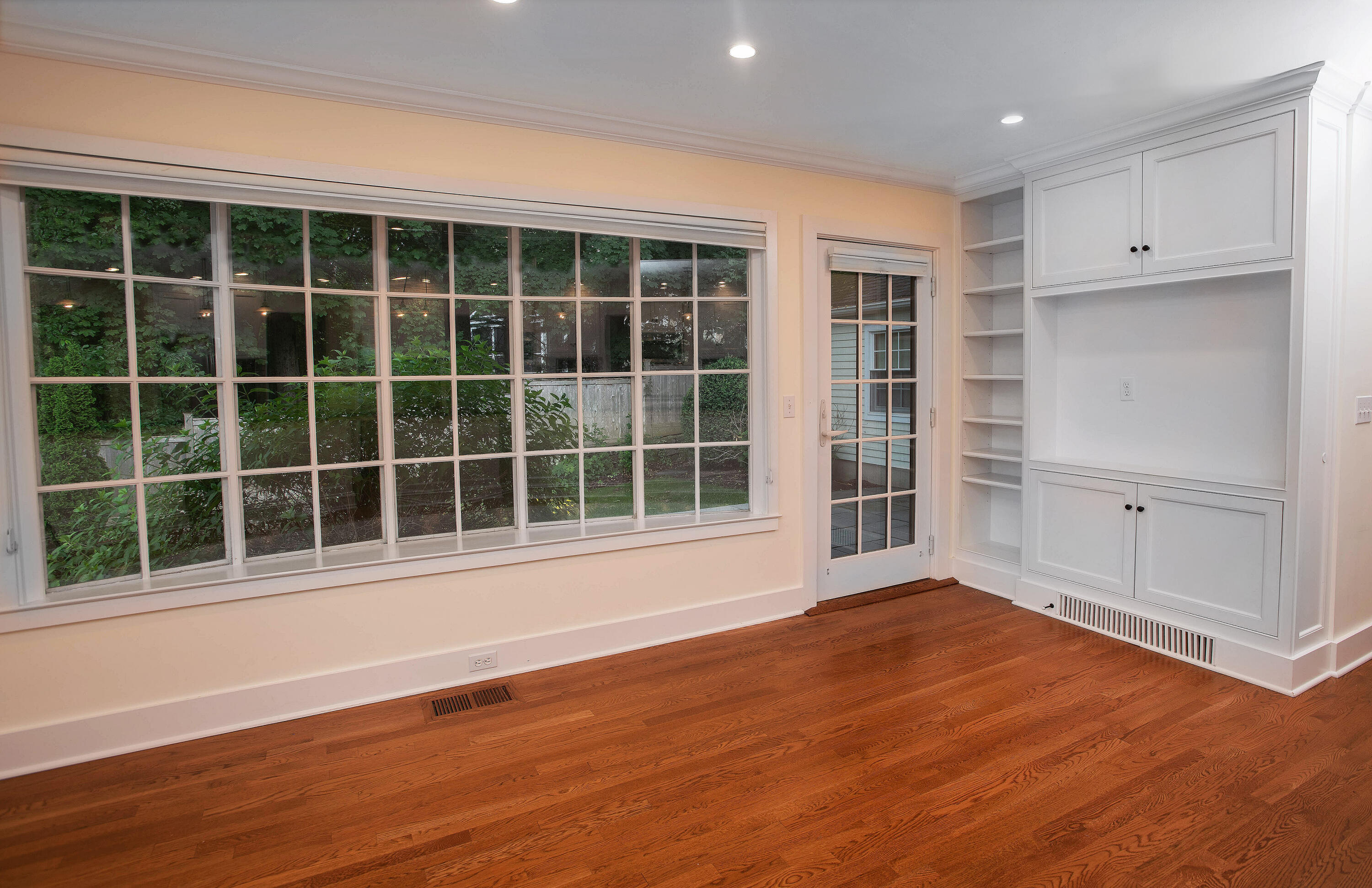 64 Sunrise Avenue New Canaan, CT 06840 - Photo 9 of 22 an empty room with wooden floor and windows