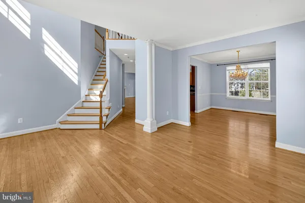 a view of hallway with wooden floor