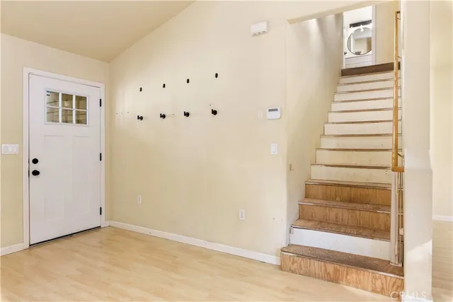 a view of a bathroom from a corridor