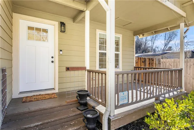 a view of porch with a bench