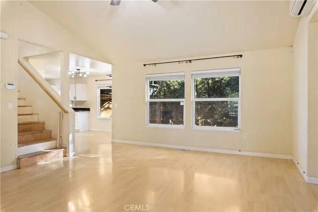 a view of an empty room with a window
