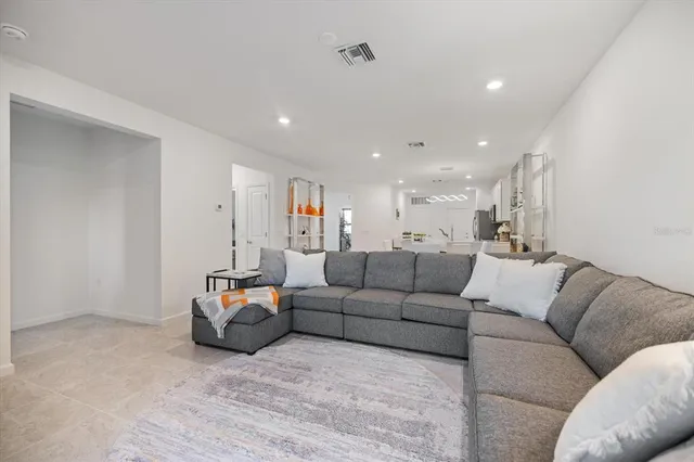 a living room with furniture and a table