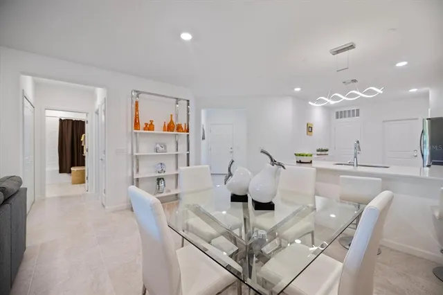 a living room with furniture a window and a table