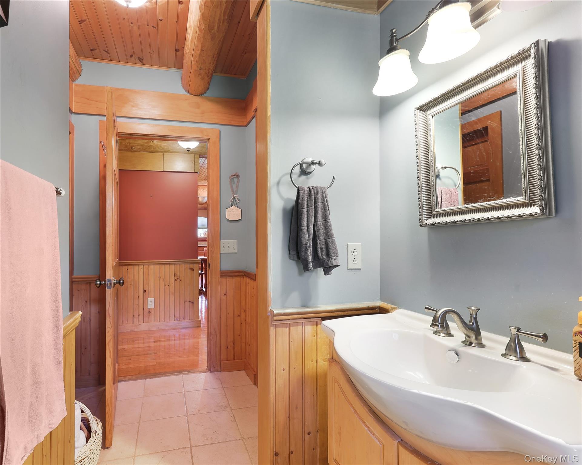25 Cauthers Road Fallsburg, NY 12789 - Photo 21 of 27 a bathroom with a sink and a mirror