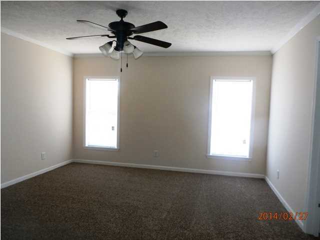 725 Sandy Ramp Road DeFuniak Springs, FL 32433 - Photo 11 of 20 an empty room with a window and a fan
