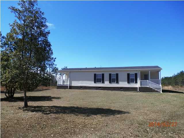 725 Sandy Ramp Road DeFuniak Springs, FL 32433 - Photo 2 of 20 front view of a house with a yard