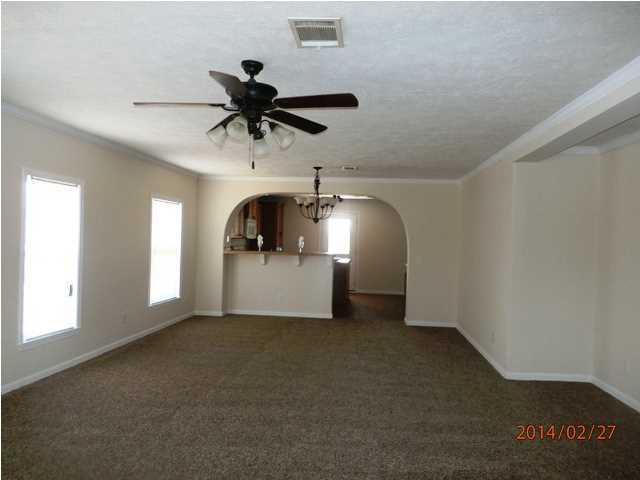 725 Sandy Ramp Road DeFuniak Springs, FL 32433 - Photo 6 of 20 a view of a livingroom with a ceiling fan and window