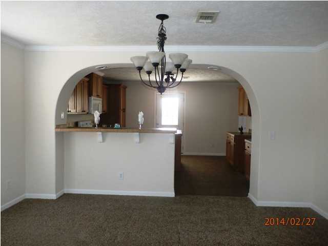 725 Sandy Ramp Road DeFuniak Springs, FL 32433 - Photo 7 of 20 a view of a hallway with a chandelier