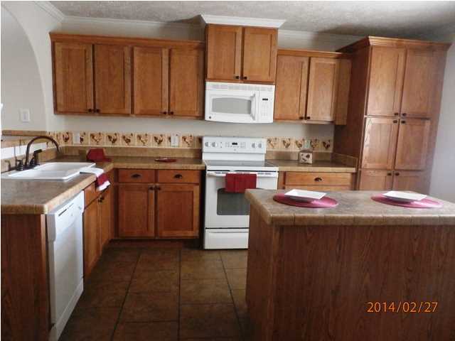 725 Sandy Ramp Road DeFuniak Springs, FL 32433 - Photo 8 of 20 a kitchen with a sink stove and cabinets