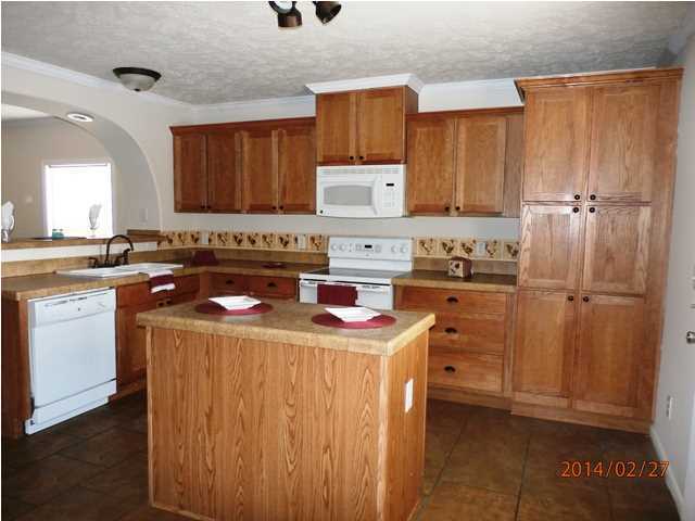 725 Sandy Ramp Road DeFuniak Springs, FL 32433 - Photo 9 of 20 a kitchen with a sink a stove and cabinets