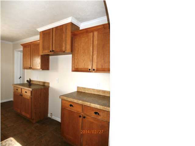 725 Sandy Ramp Road DeFuniak Springs, FL 32433 - Photo 10 of 20 a kitchen with stainless steel appliances granite countertop a refrigerator and a stove top oven