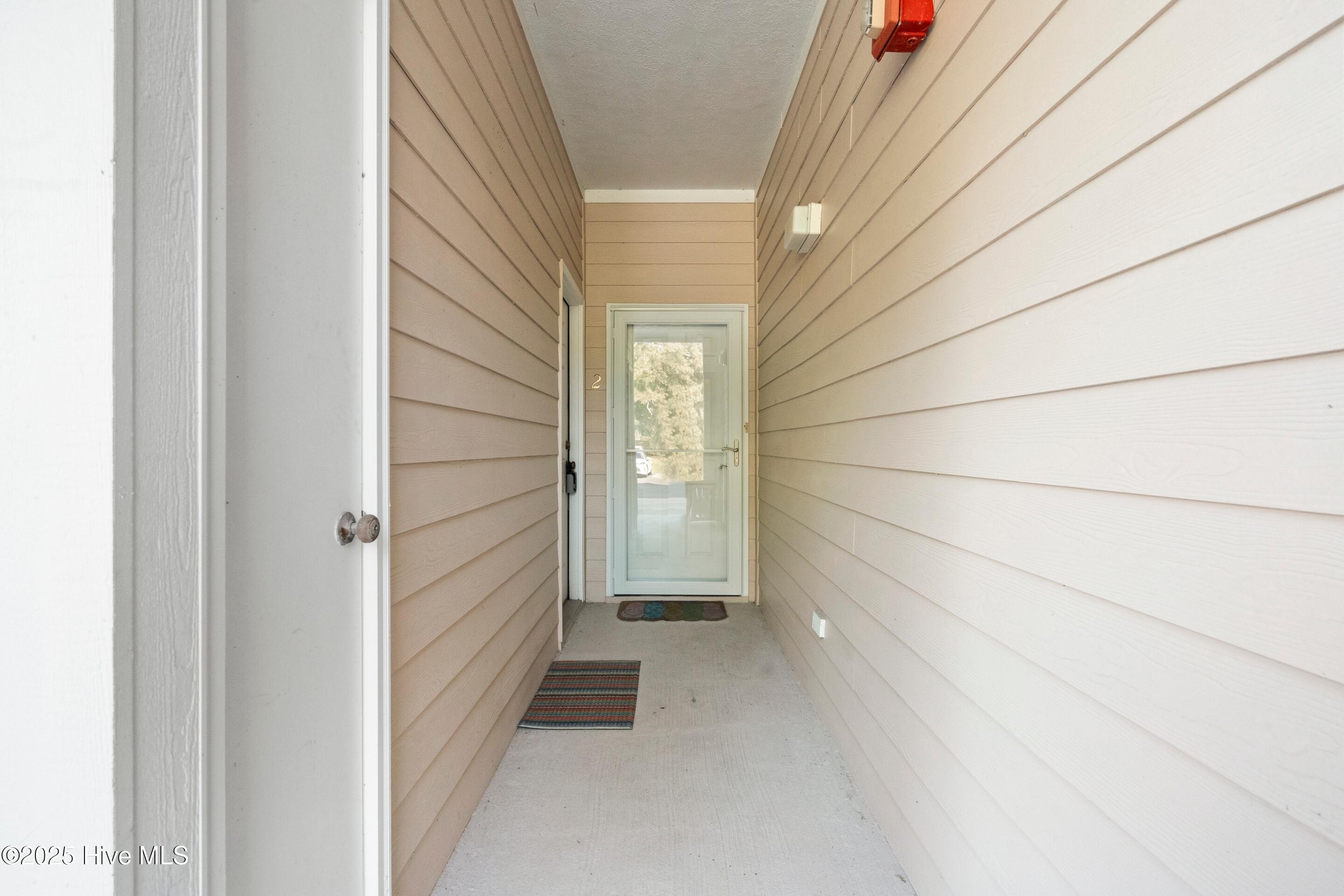 180 Clubhouse Road, Unit 2 Sunset Beach, NC 28468 - Photo 3 of 49 Front Door