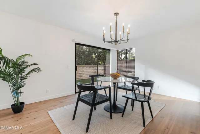 a view of kitchen with furniture and wooden floor