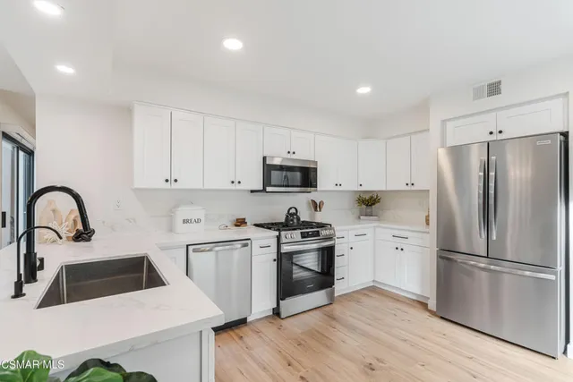 a potted plant sitting on top of a hallway