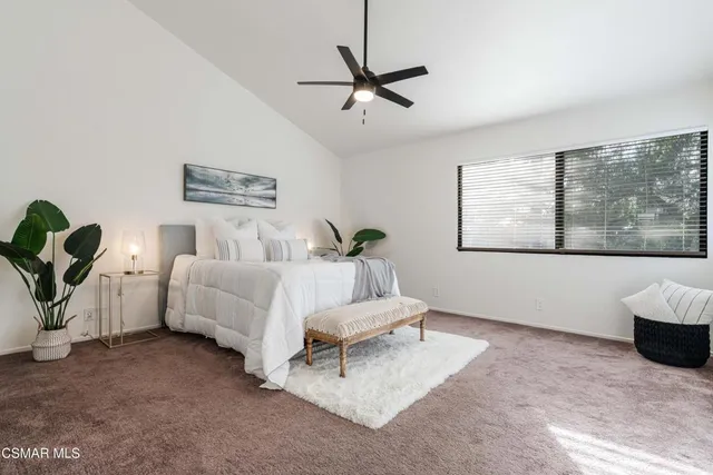 a view of an empty room and a window