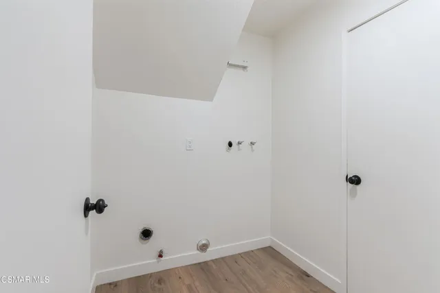 a view of a chairs and table in backyard