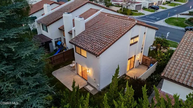 a front view of house with yard outdoor seating and barbeque oven