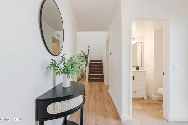 a bathroom with a sink vanity and mirror