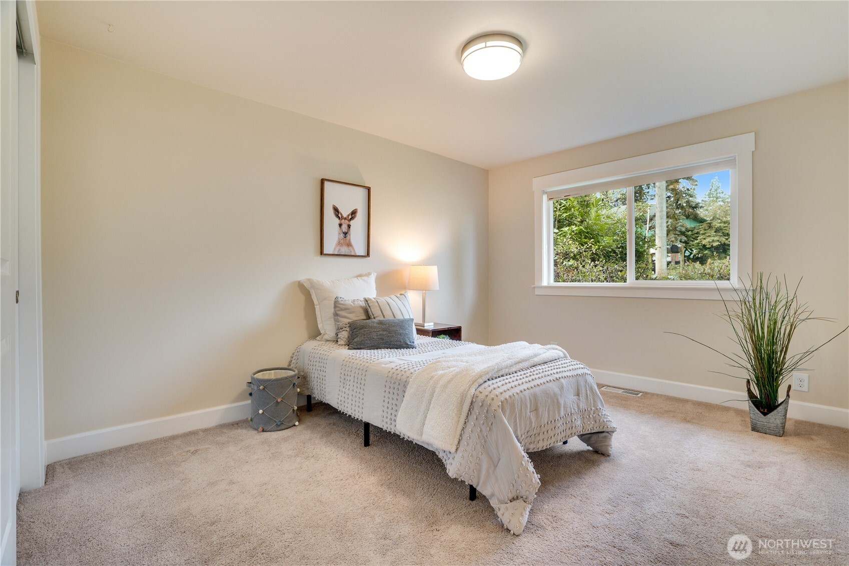 20018 Meridian Place North Shoreline, WA 98133 - Photo 23 of 37 a bedroom with a bed and a potted plant