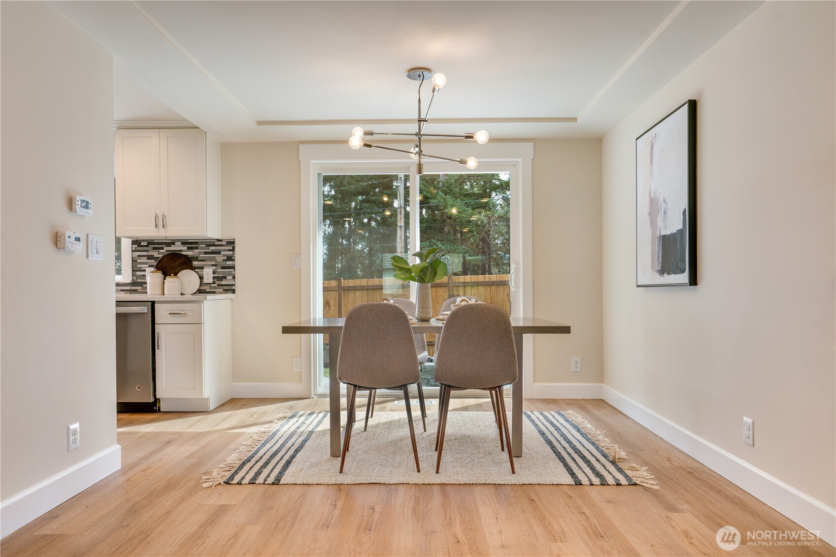 20018 Meridian Place North Shoreline, WA 98133 - Photo 8 of 37 a view of a dining room with furniture window and wooden floor