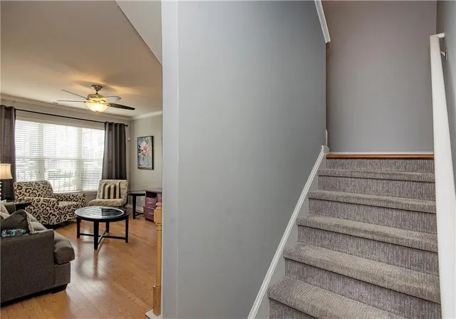 a view of entryway and hall with wooden floor