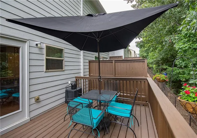 a view of a chairs in wooden deck