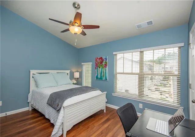 a bedroom with a large bed and a window