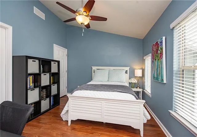 a bedroom with a bed furniture and a window