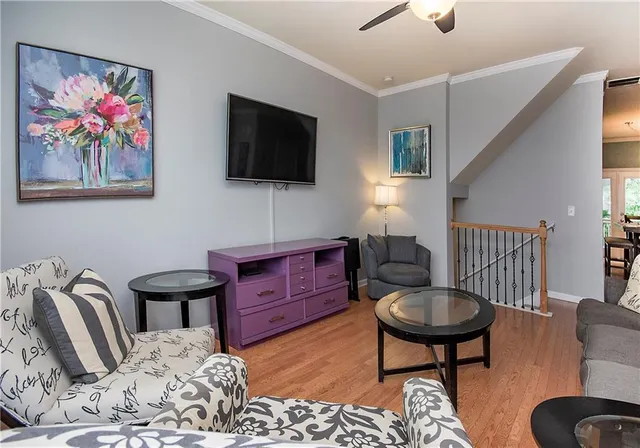 a bedroom with furniture and a flat screen tv