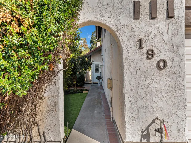 a view of a pathway both side of the house