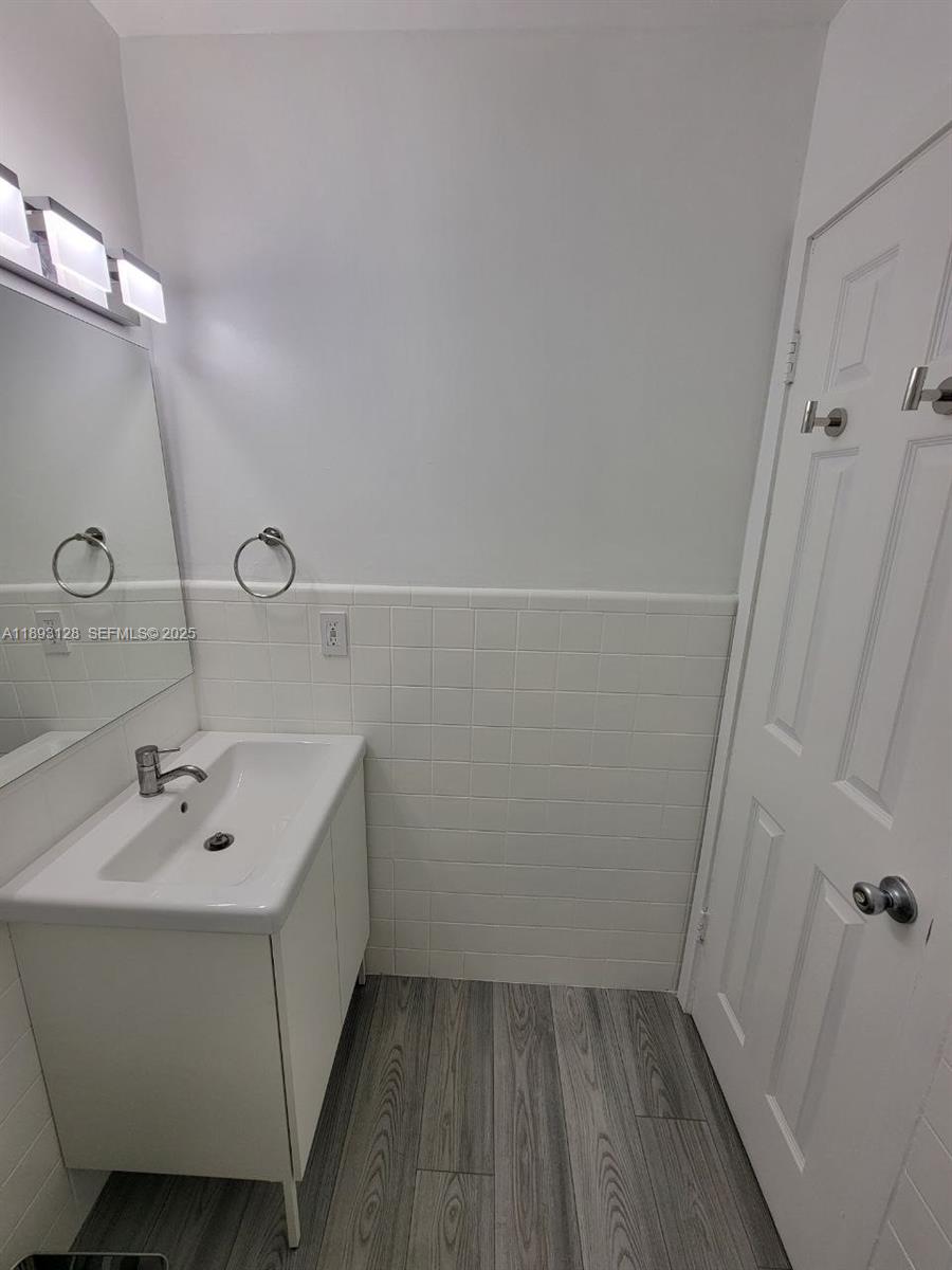 3300 Southwest 9th Terrace Miami, FL 33135 - Photo 13 of 25 a bathroom with a sink and shower