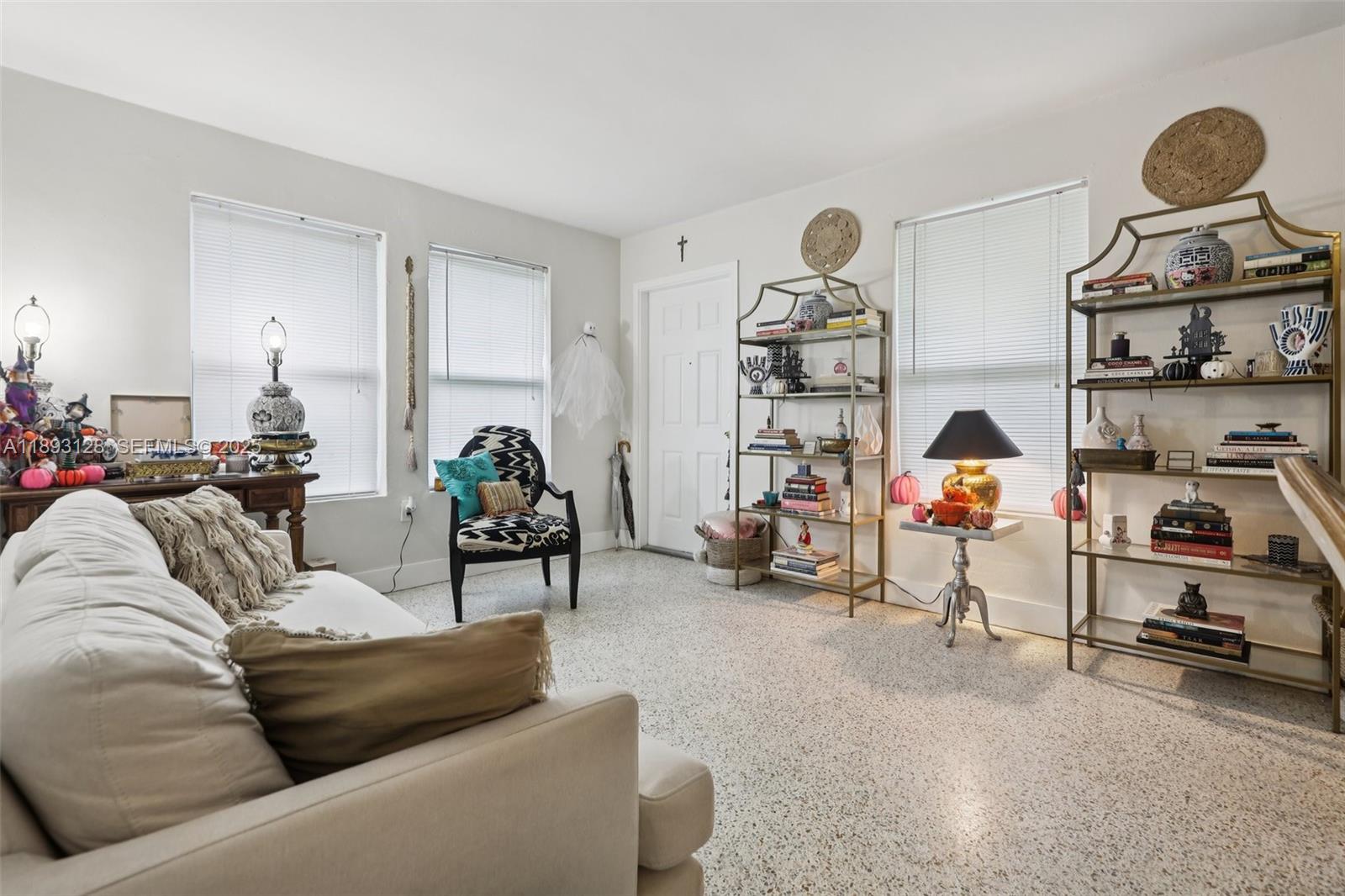 3300 Southwest 9th Terrace Miami, FL 33135 - Photo 14 of 25 a living room with furniture and a gym machine