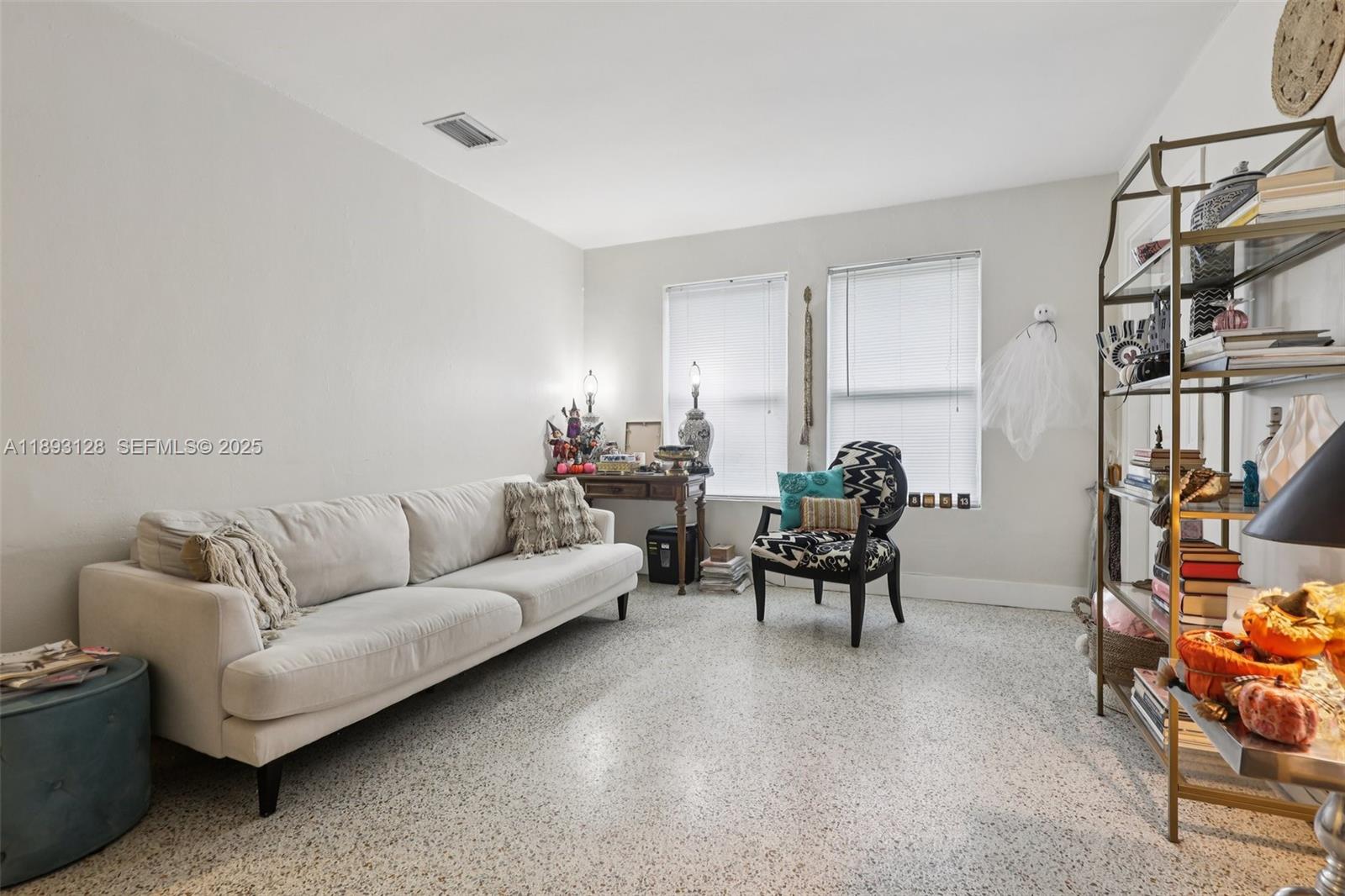 3300 Southwest 9th Terrace Miami, FL 33135 - Photo 15 of 25 a living room with furniture a rug and a window