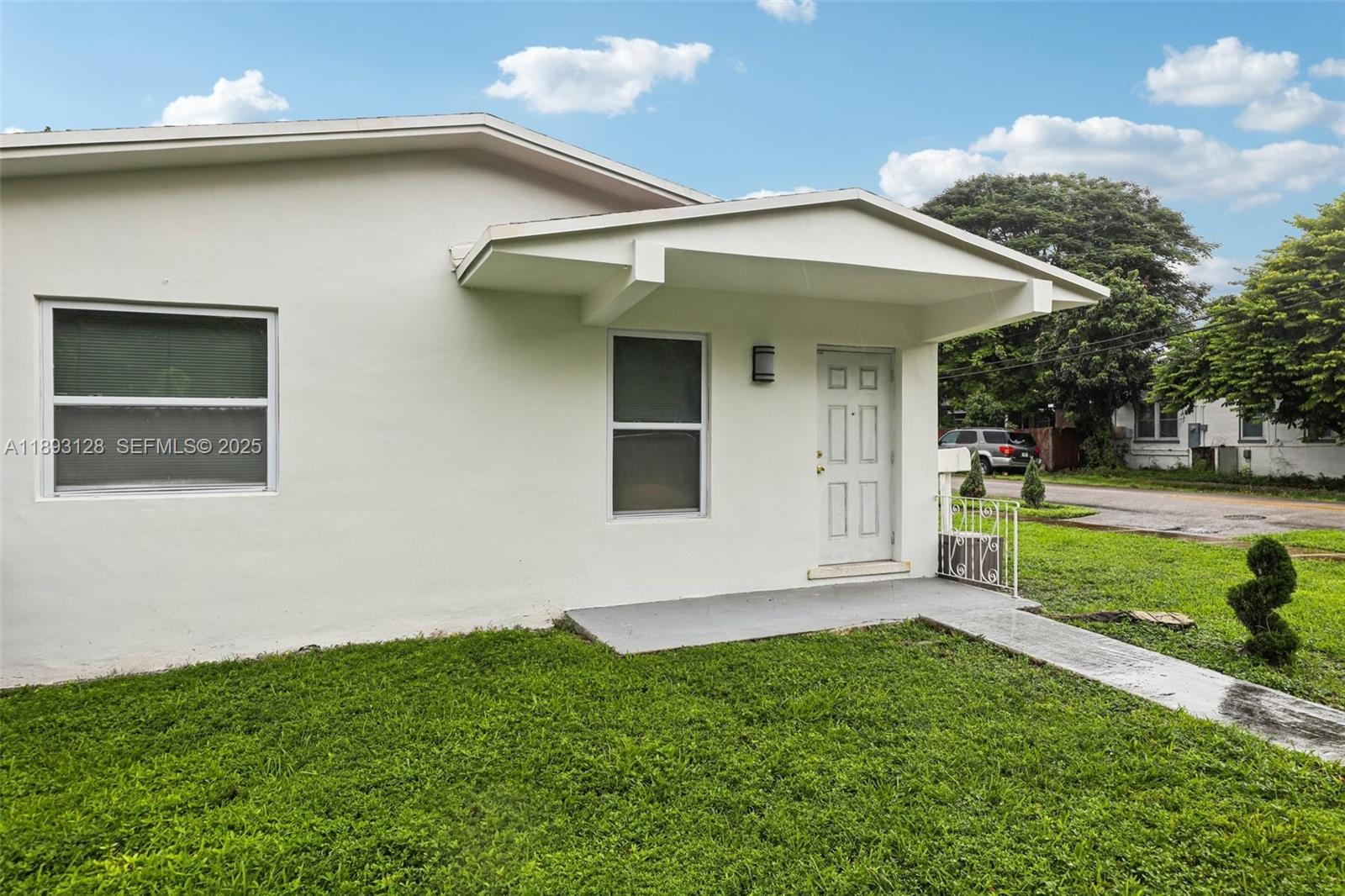 3300 Southwest 9th Terrace Miami, FL 33135 - Photo 2 of 25 a view of a house with a yard