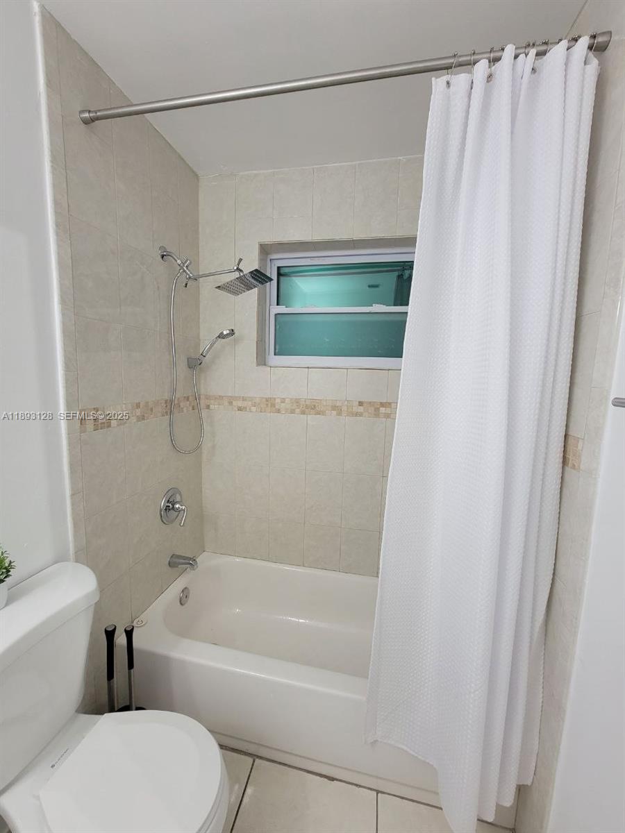 3300 Southwest 9th Terrace Miami, FL 33135 - Photo 23 of 25 a bathroom with a toilet and a bathtub