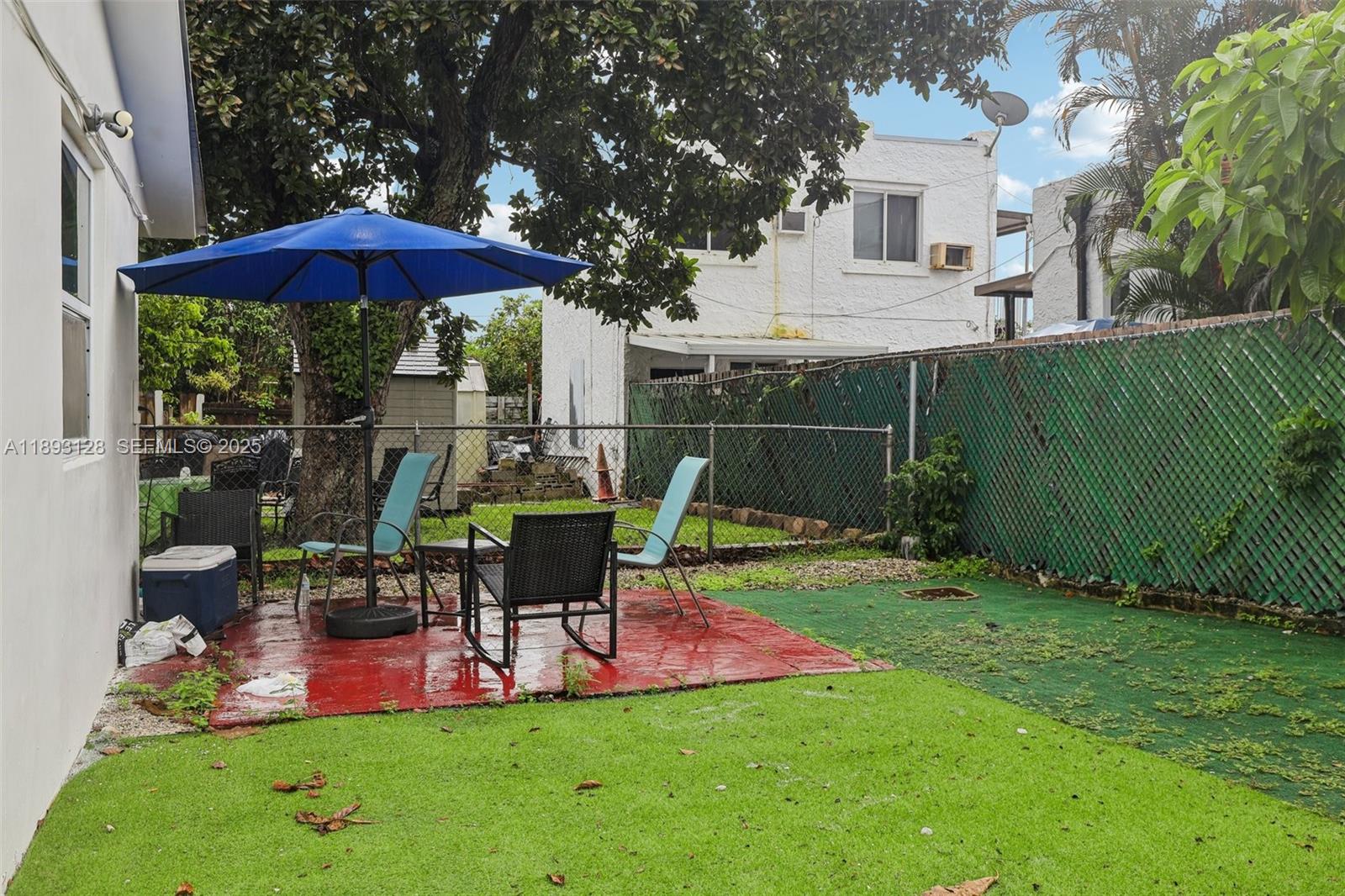 3300 Southwest 9th Terrace Miami, FL 33135 - Photo 24 of 25 a view of a chair and table under an umbrella