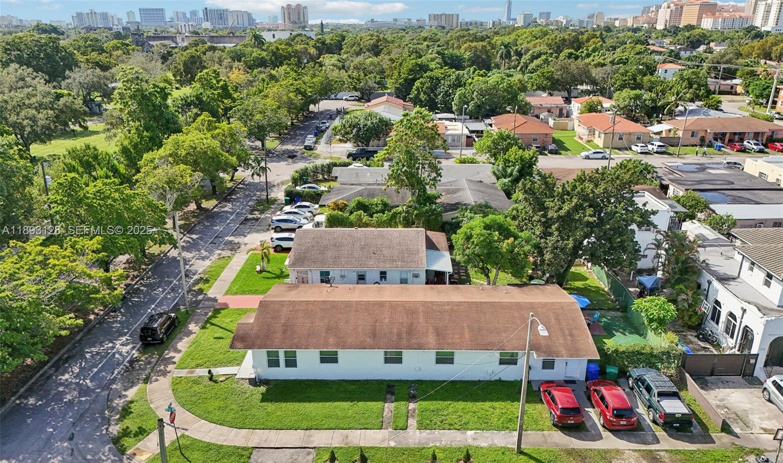 3300 Southwest 9th Terrace Miami, FL 33135 - Photo 5 of 25 a aerial view of a house with swimming pool and mountains