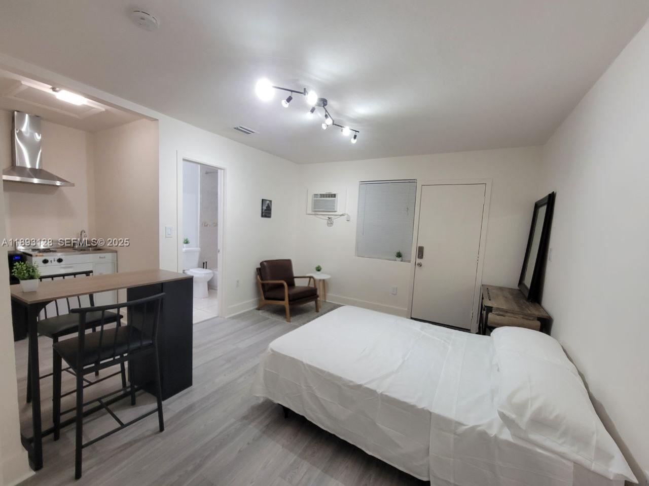 3300 Southwest 9th Terrace Miami, FL 33135 - Photo 10 of 25 a bedroom with furniture and a window