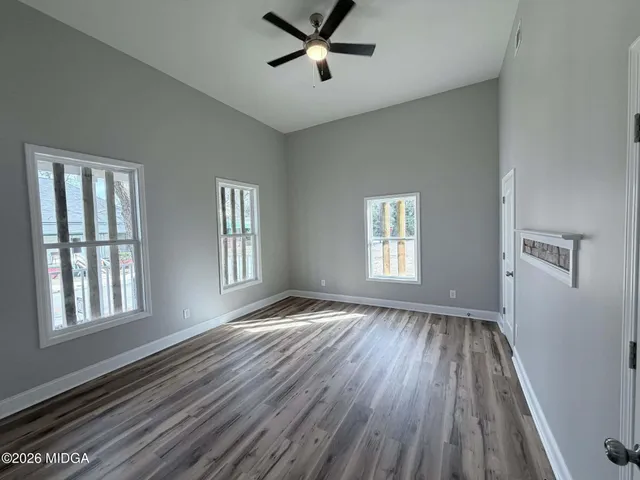 a large kitchen with kitchen island a sink stainless steel appliances and cabinets
