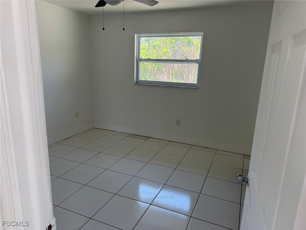 5487 Judith Road Bokeelia, FL 33922 - Photo 12 of 18 a view of an empty room with a window
