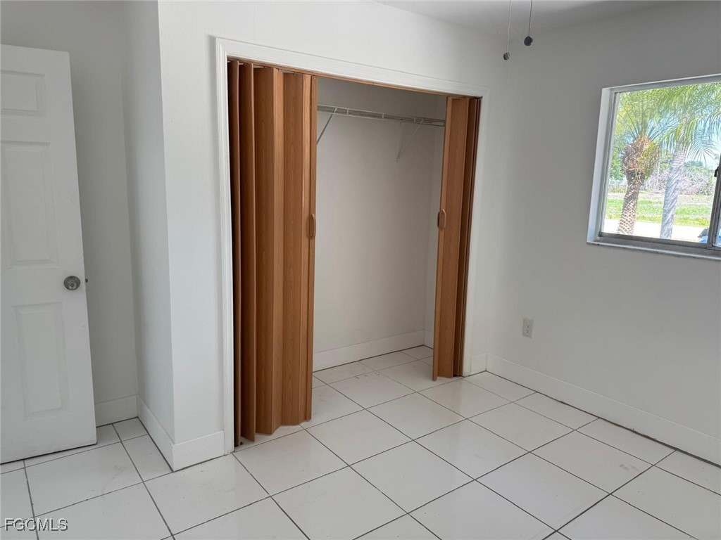 5487 Judith Road Bokeelia, FL 33922 - Photo 15 of 18 an empty room with windows