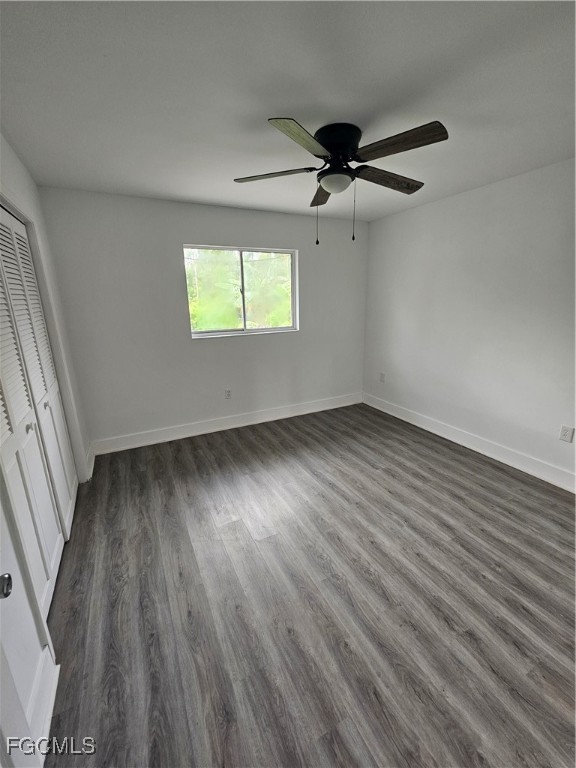 5487 Judith Road Bokeelia, FL 33922 - Photo 5 of 18 wooden floor in an empty room with a window